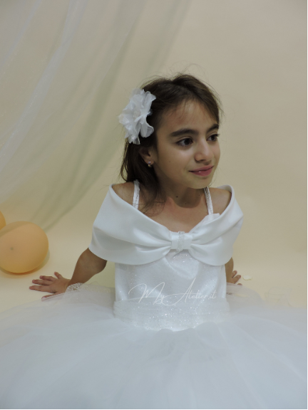 Vestito comunione con grande fiocco sulle spalle